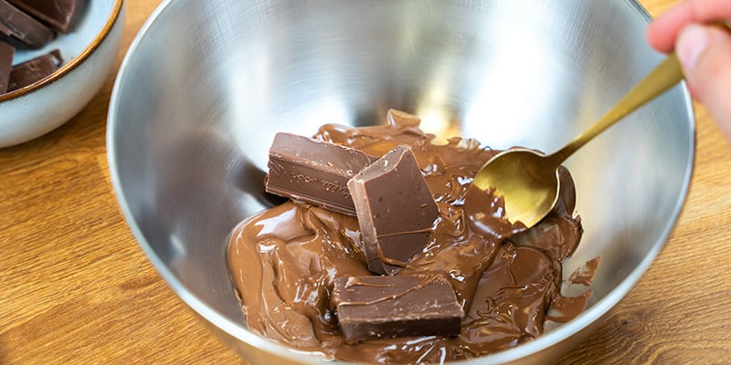 Once the chocolate melts, remove it from the heat and add another ¼ Once the chocolate melts, remove it from the heat and add another ¼