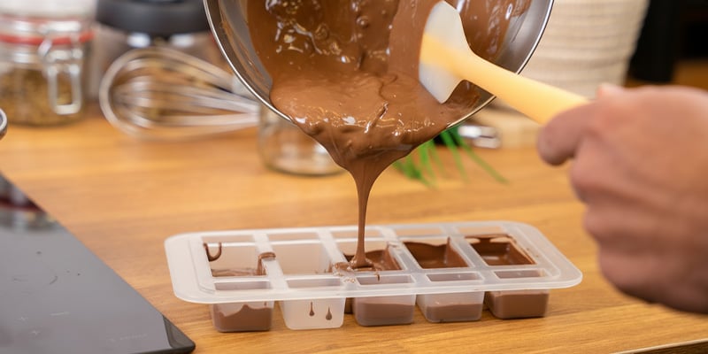 Pour the chocolate into a mould, let it set, then store it in an airtight container in the fridge Pour the chocolate into a mould, let it set, then store it in an airtight container in the fridge